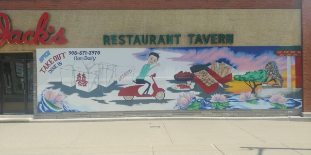 Graffiti devant un restaurant chinois